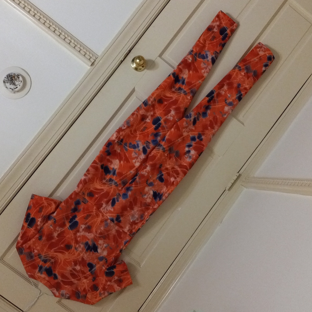 Orange jumpsuit with blue white and red